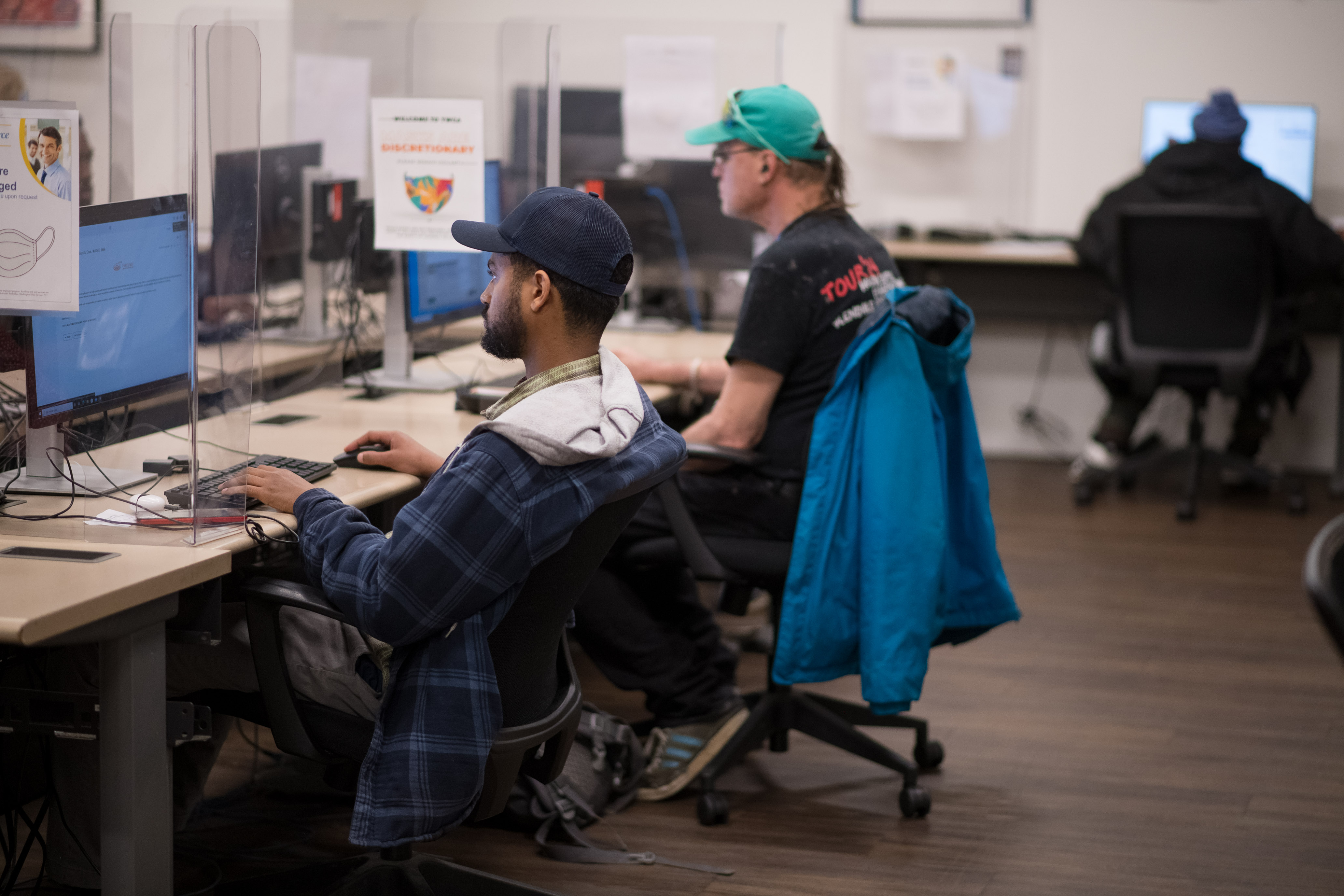 workers searching for jobs in computer lab