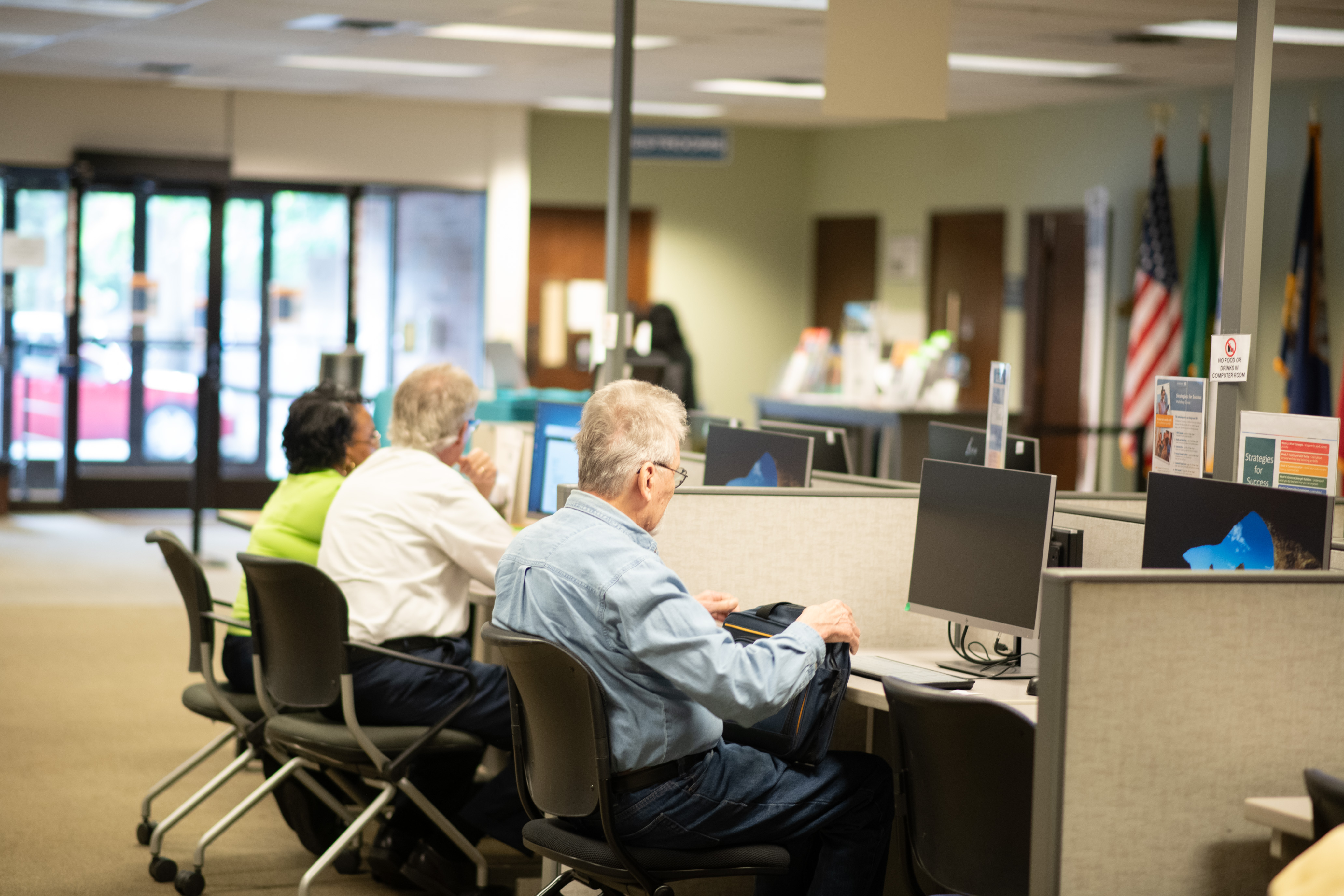 Rainer worksource computer lab filled with elderly people using resources to find jobs