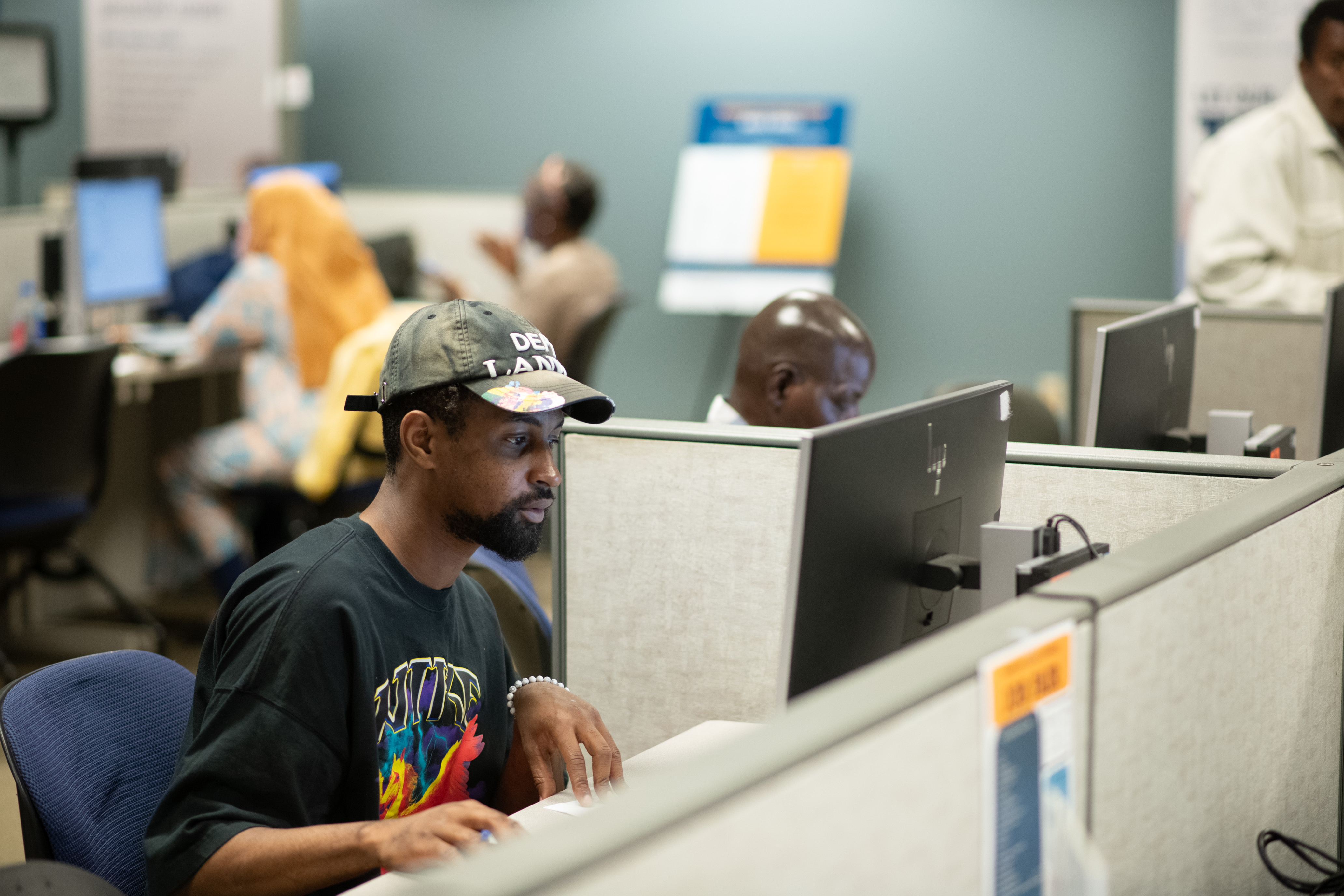 Rainer worksource computer lab filled with people using resources to find jobs