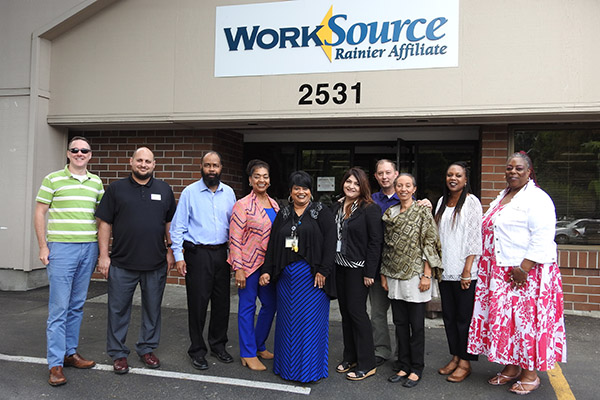 Image of a group of people outside the Work Source Rainier Affiliate building.