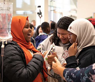 women in hijabs talks at hospital